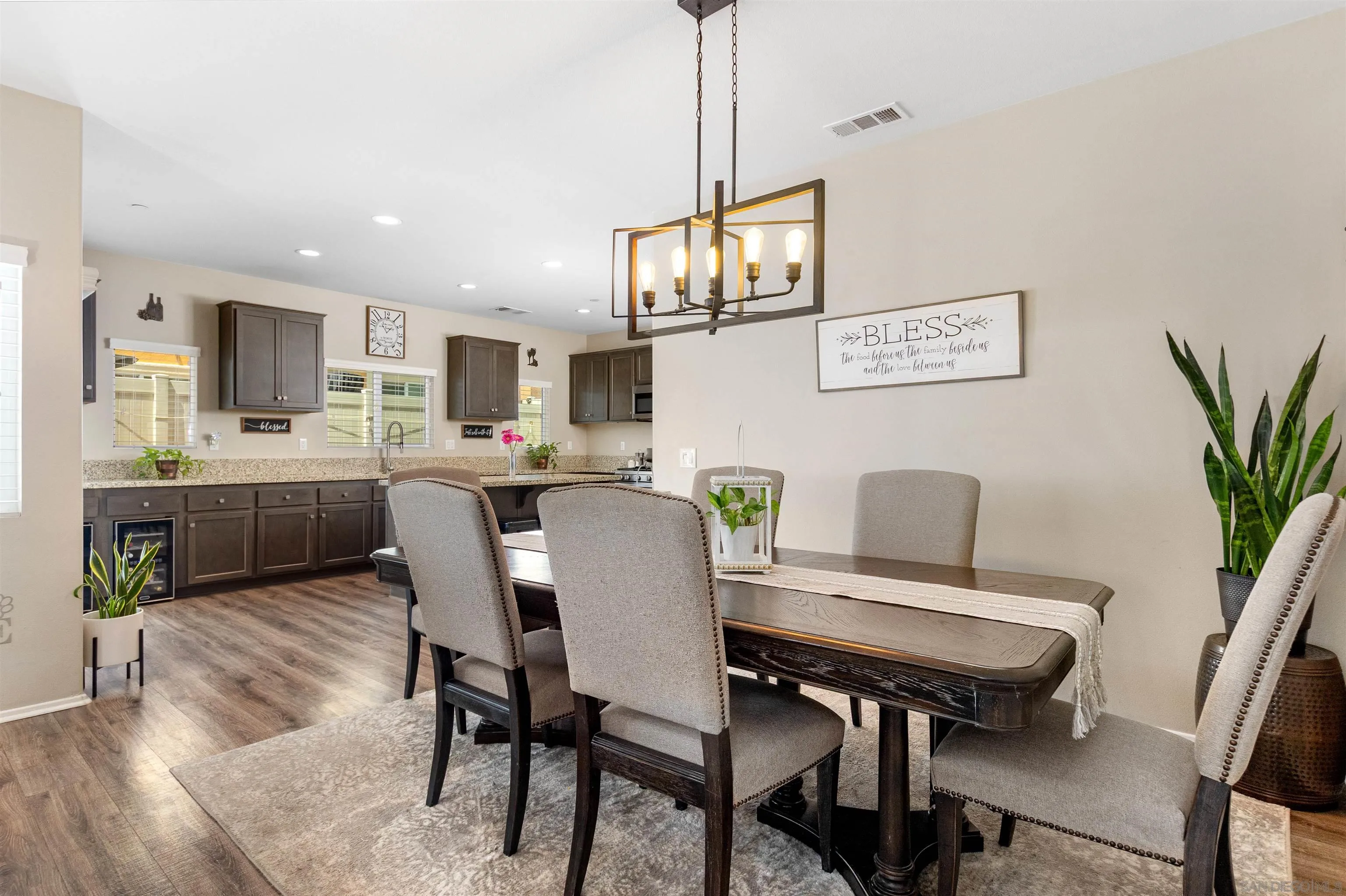216 Oberlander Way Fallbrook, CA 92028 - Photo 2 of 31 a view of a dining room with furniture and a chandelier