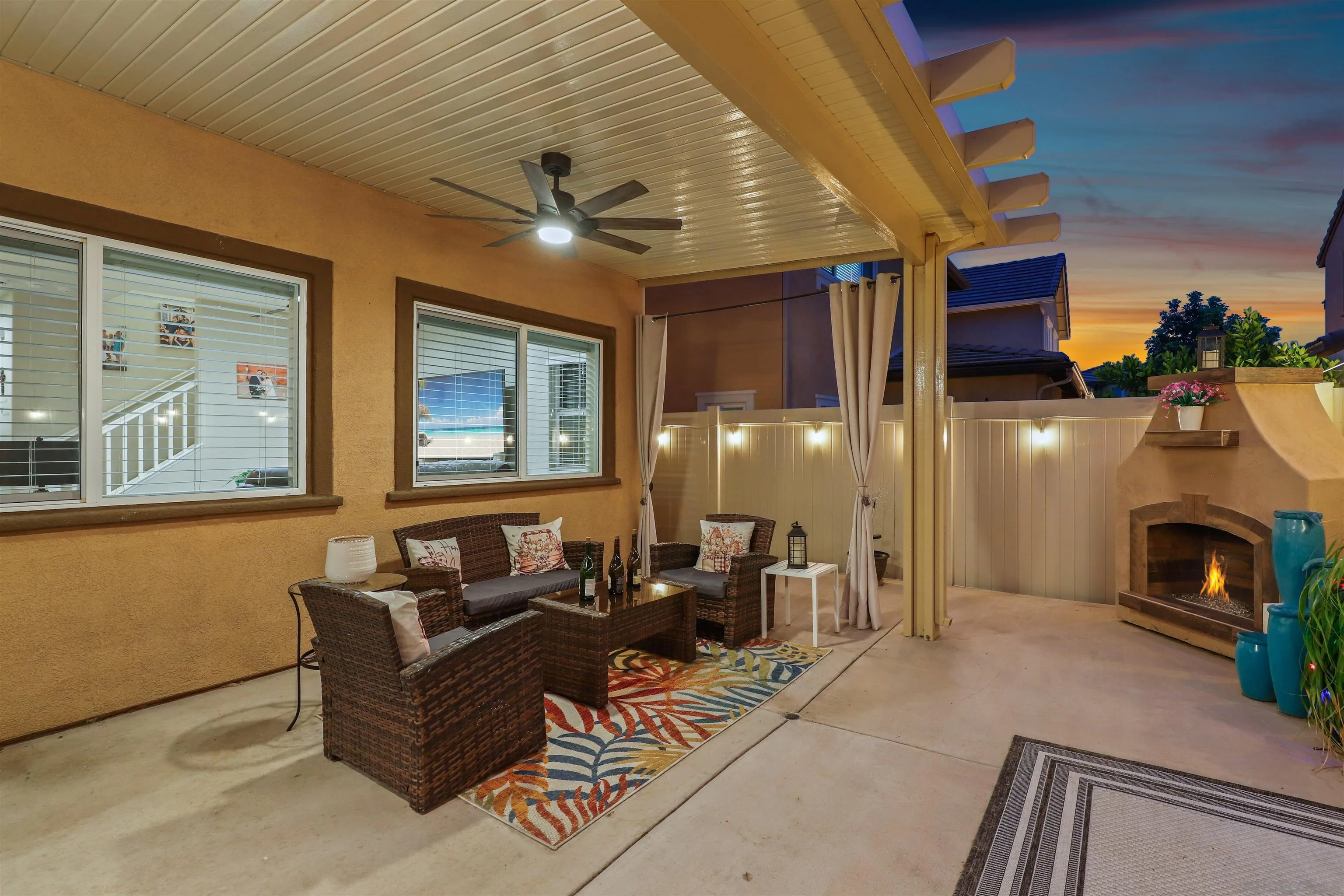 216 Oberlander Way Fallbrook, CA 92028 - Photo 21 of 31 a living room with furniture a fireplace and a chandelier