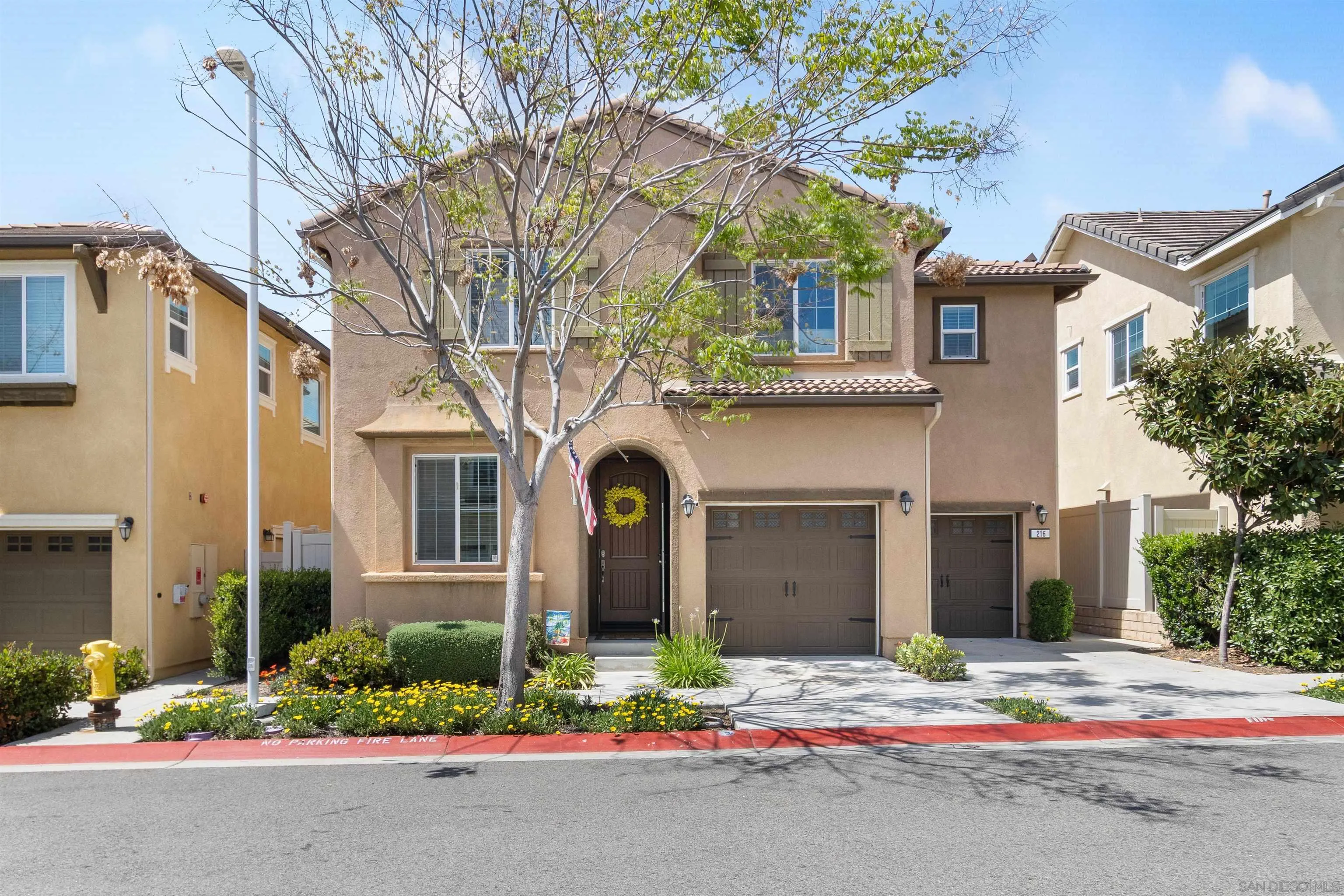 216 Oberlander Way Fallbrook, CA 92028 - Photo 22 of 31 a front view of a house with a yard and garage