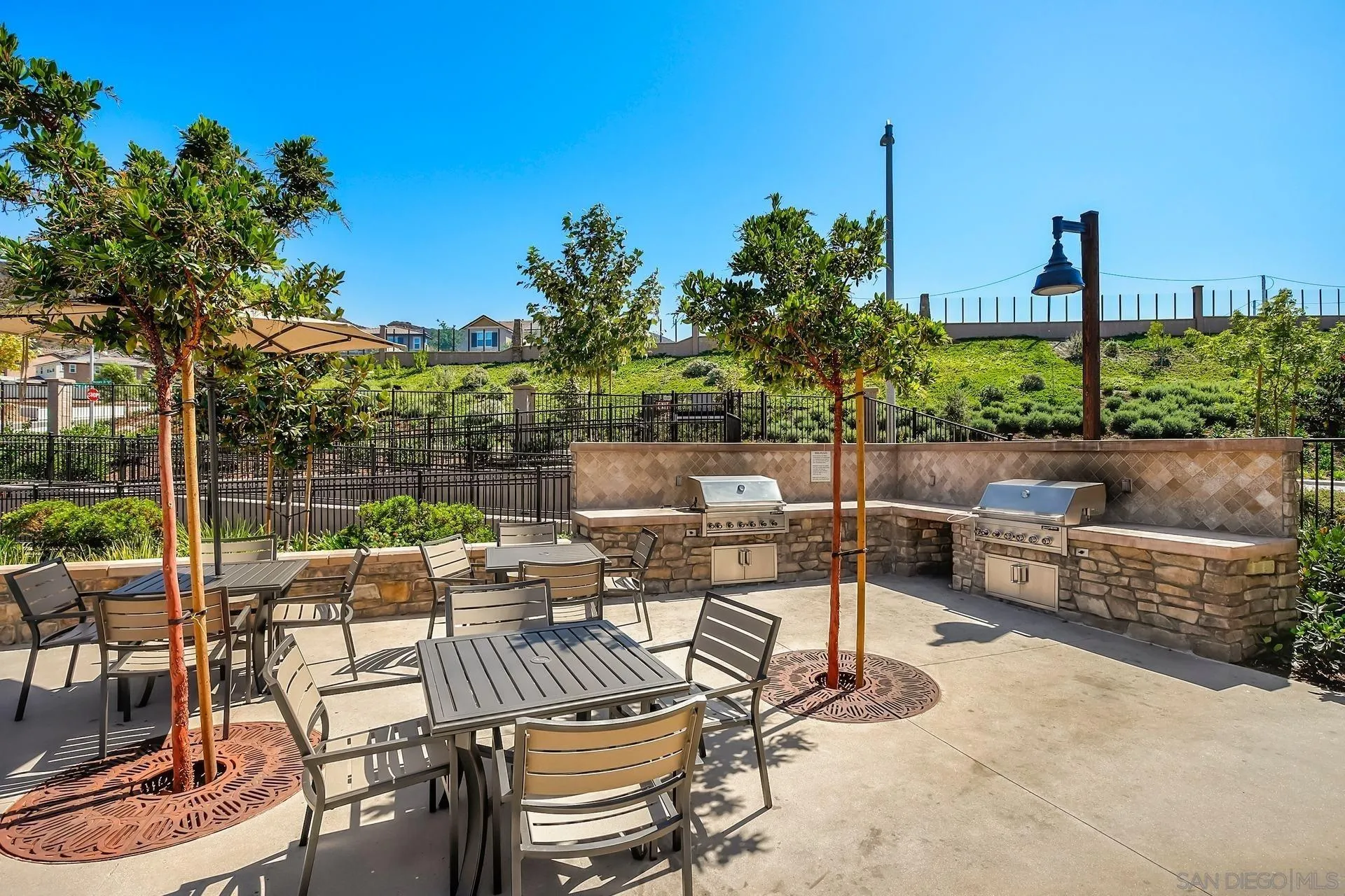 216 Oberlander Way Fallbrook, CA 92028 - Photo 27 of 31 a view of a patio with couches chairs and potted plants