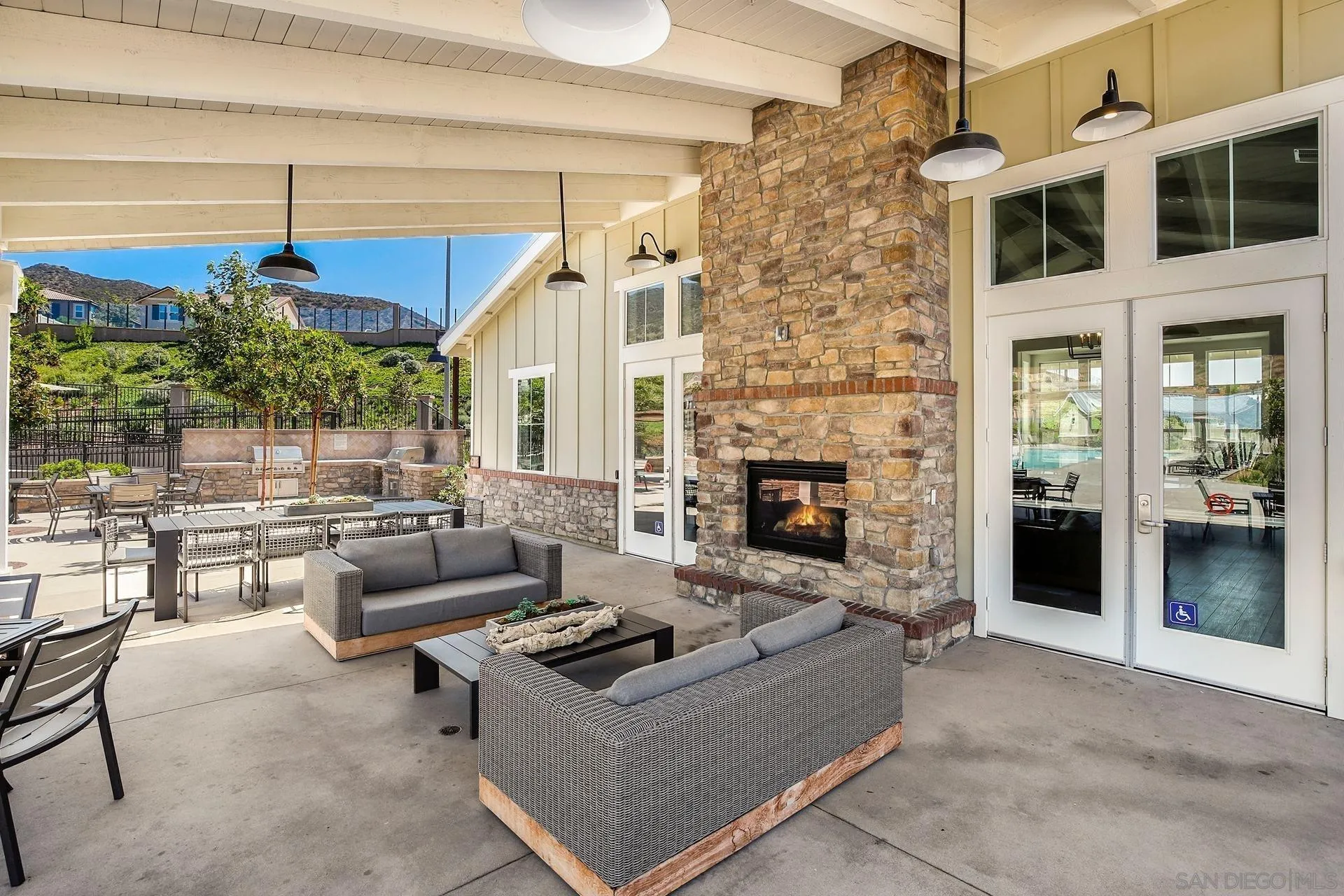 216 Oberlander Way Fallbrook, CA 92028 - Photo 28 of 31 a living room with furniture potted plant and a fireplace