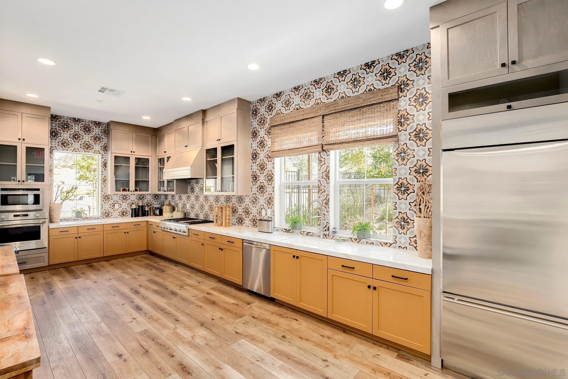 216 Oberlander Way Fallbrook, CA 92028 - Photo 31 of 31 a large kitchen with kitchen island a large window a sink and stainless steel appliances