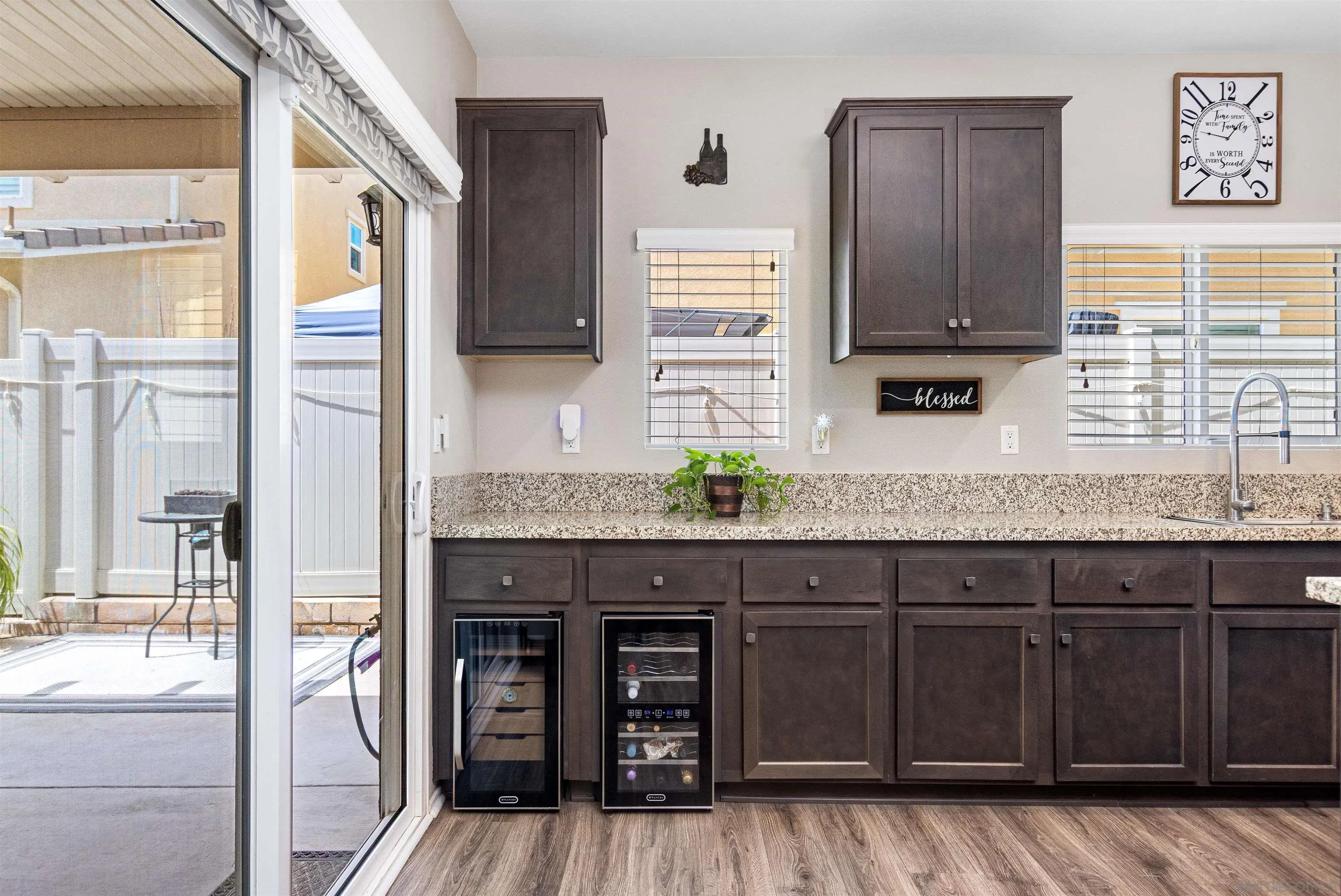216 Oberlander Way Fallbrook, CA 92028 - Photo 9 of 31 a kitchen with granite countertop wooden cabinets and a granite counter tops