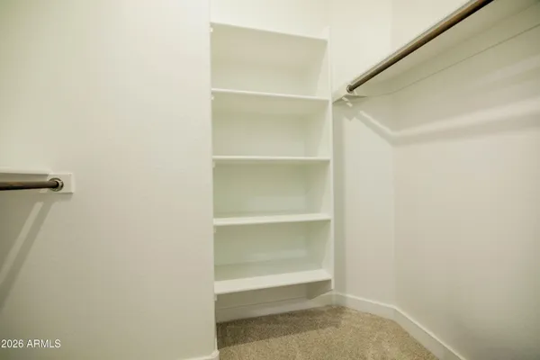 a view of an empty walk in closet