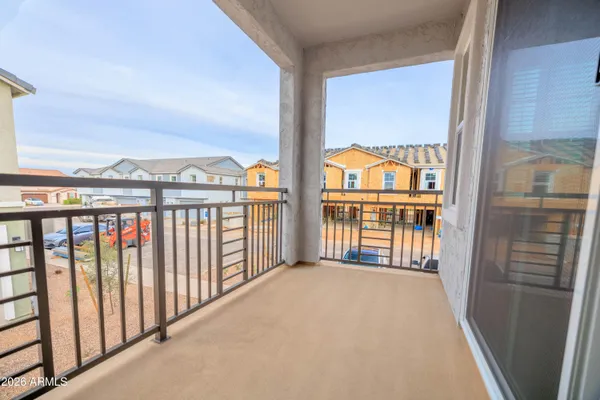 a view of a glass door with a balcony