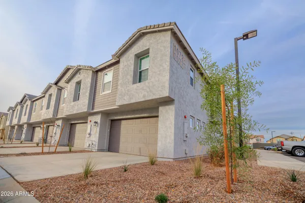 a view of a backyard of the house