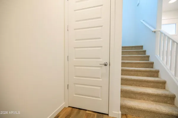 a view of walk in closet with empty racks