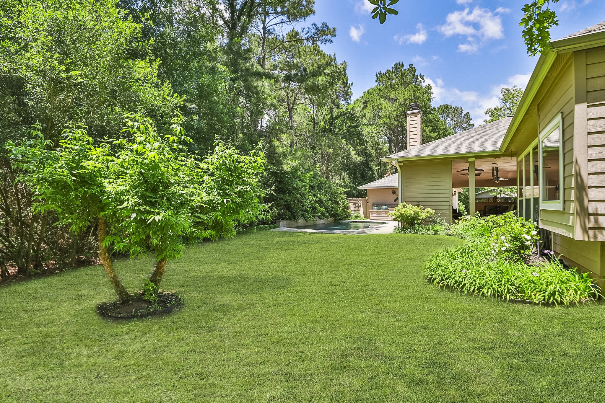 7514 Saddle Blanket Drive Waller, TX 77484 - Photo 37 of 50 Relax on the bench and soak in the tranquility of this serene backyard oasis and all it has to offer.