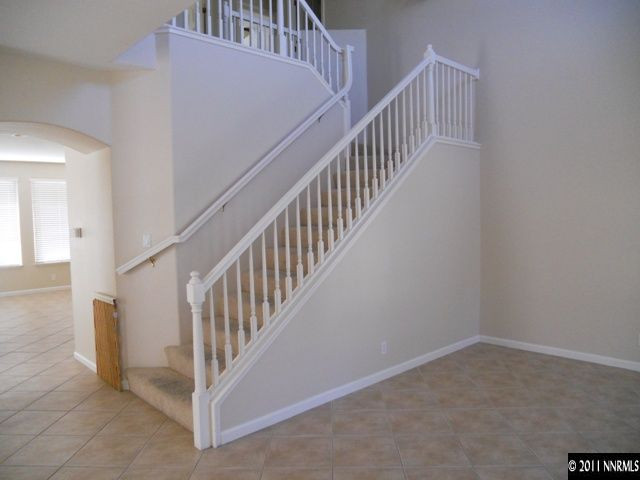 1065 Greenwich Way Reno, NV 89519 - Photo 7 of 13 a view of staircase with railing and white walls