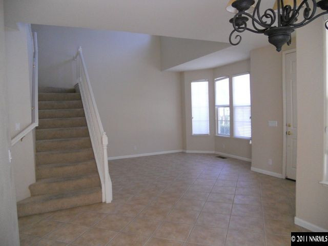 1065 Greenwich Way Reno, NV 89519 - Photo 8 of 13 a view of an empty room with a window
