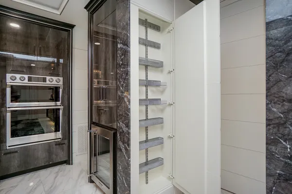 a refrigerator freezer and a stove sitting inside of a kitchen