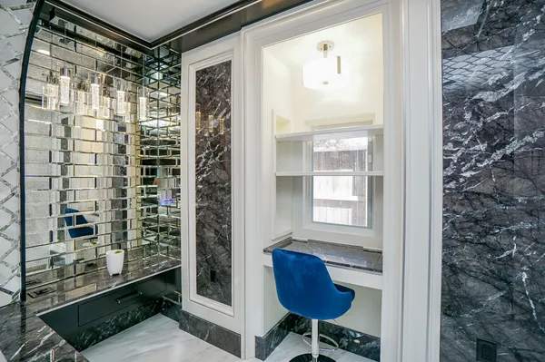 a bathroom with a shower and a sink