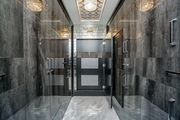 a bathroom with a glass shower door