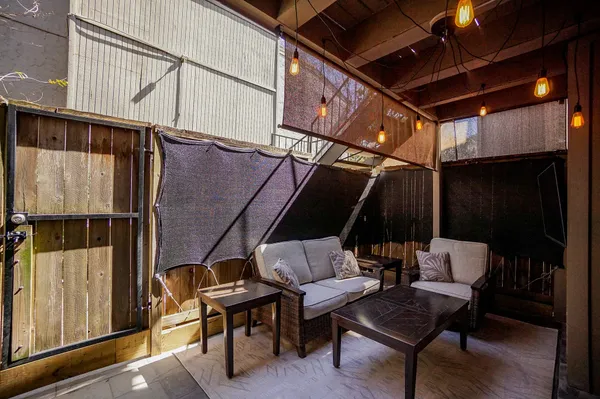 a outdoor space with patio couch and wooden floor