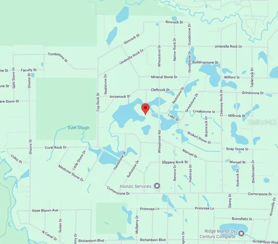 a white bath tub sitting next to a white wall