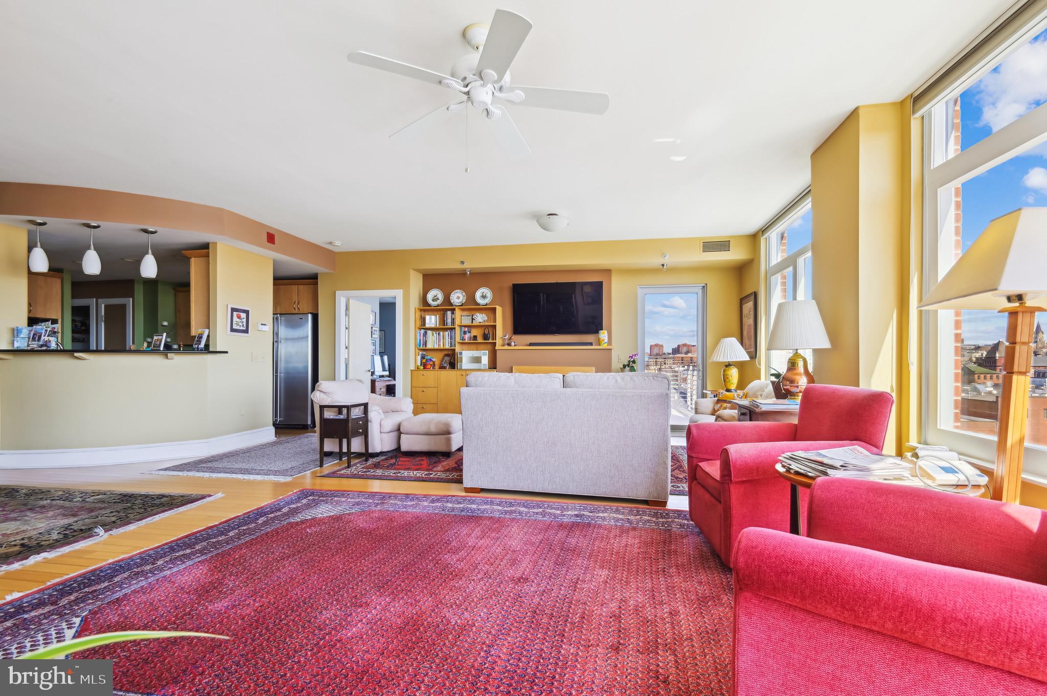 1400 Lancaster Street, Unit 605 Baltimore, MD 21231 - Photo 12 of 44 a living room with fireplace furniture and a flat screen tv