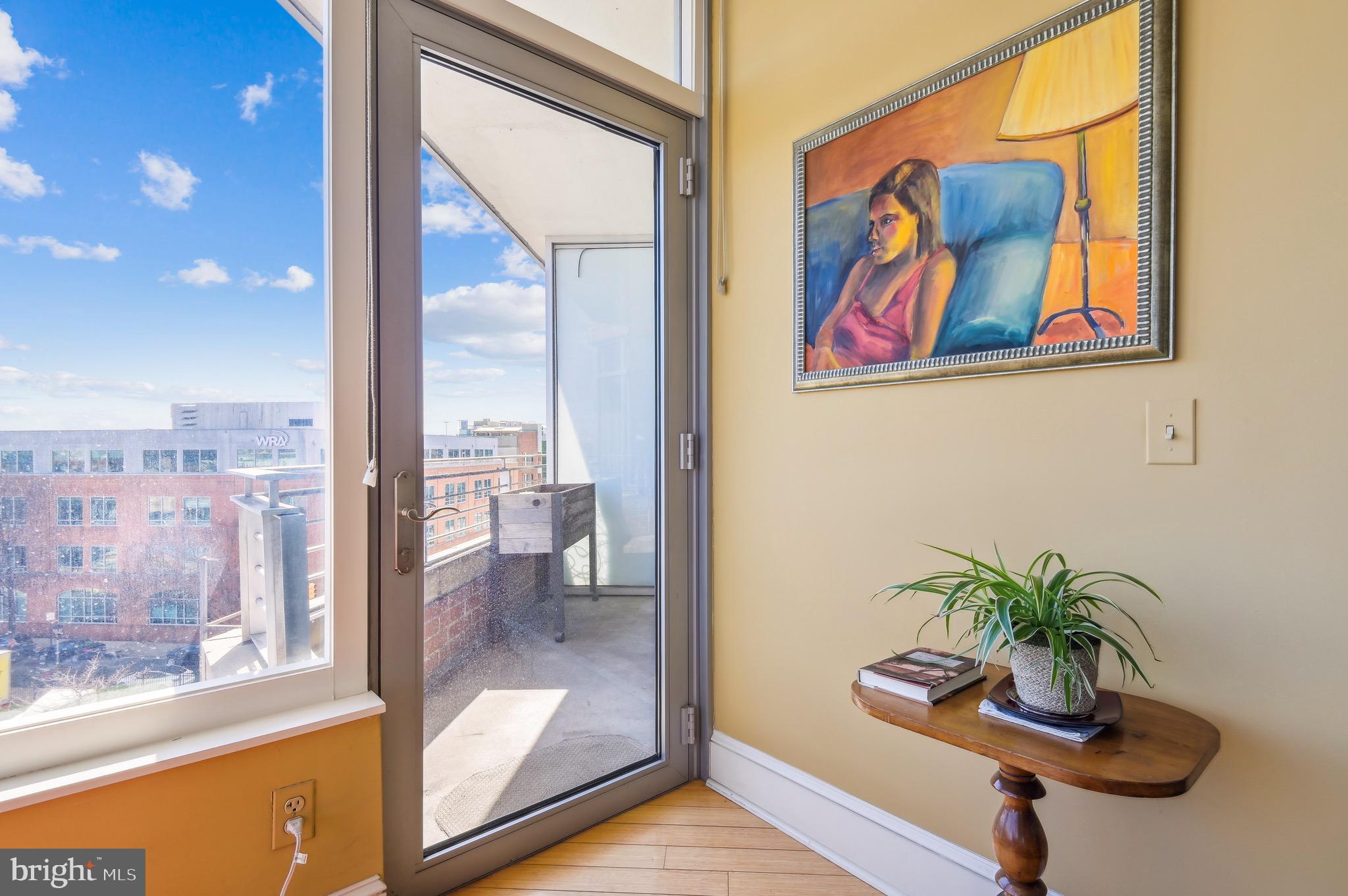 1400 Lancaster Street, Unit 605 Baltimore, MD 21231 - Photo 14 of 44 an outdoor view with glass door and glass door