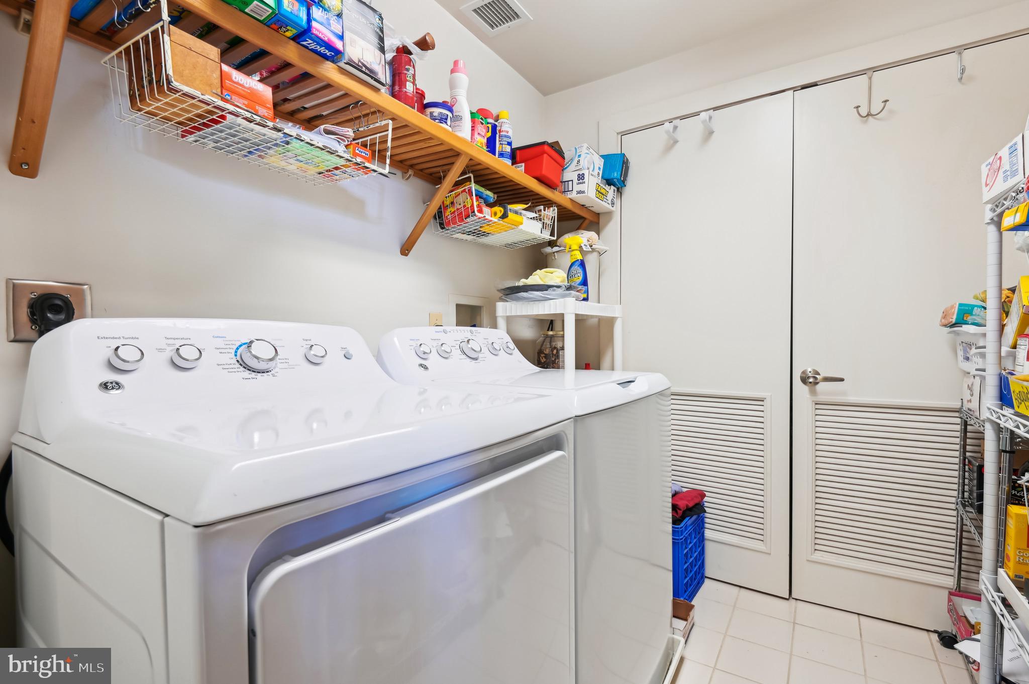 1400 Lancaster Street, Unit 605 Baltimore, MD 21231 - Photo 21 of 44 a utility room with dryer and washer
