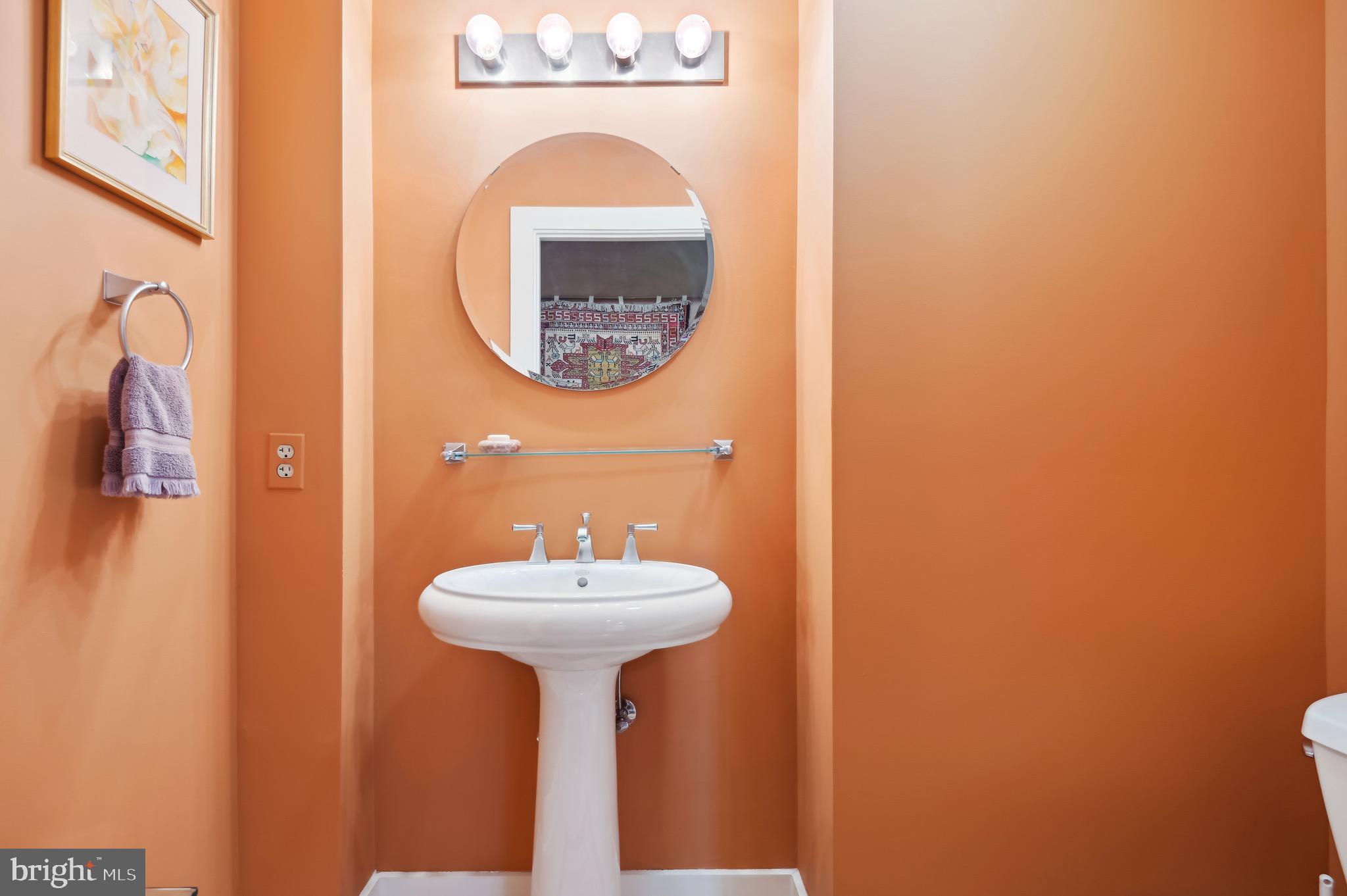 1400 Lancaster Street, Unit 605 Baltimore, MD 21231 - Photo 22 of 44 a bathroom with a sink and a mirror