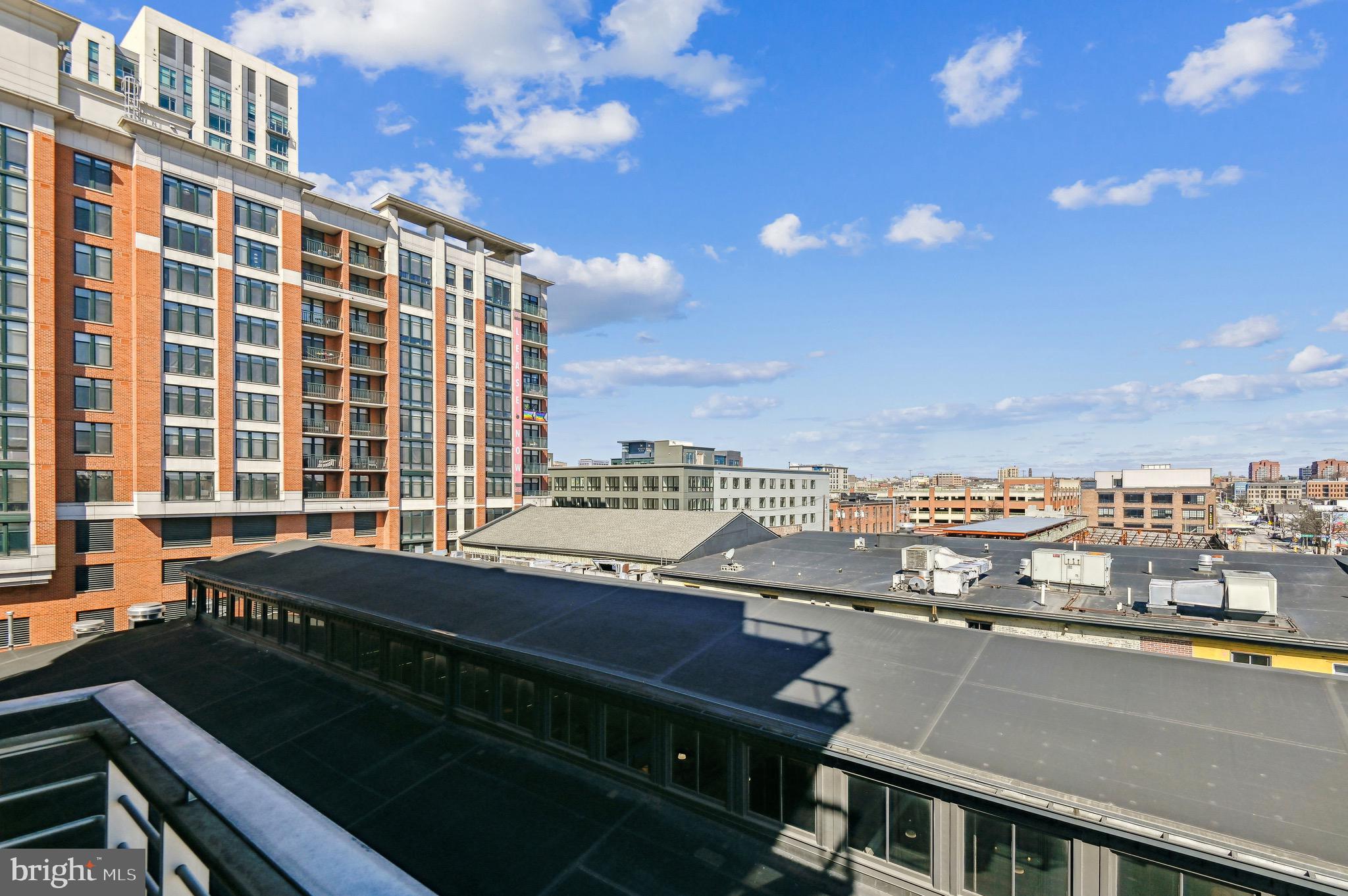 1400 Lancaster Street, Unit 605 Baltimore, MD 21231 - Photo 30 of 44 a view of a balcony with an outdoor seating