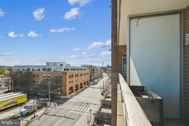a view of a balcony with two chairs
