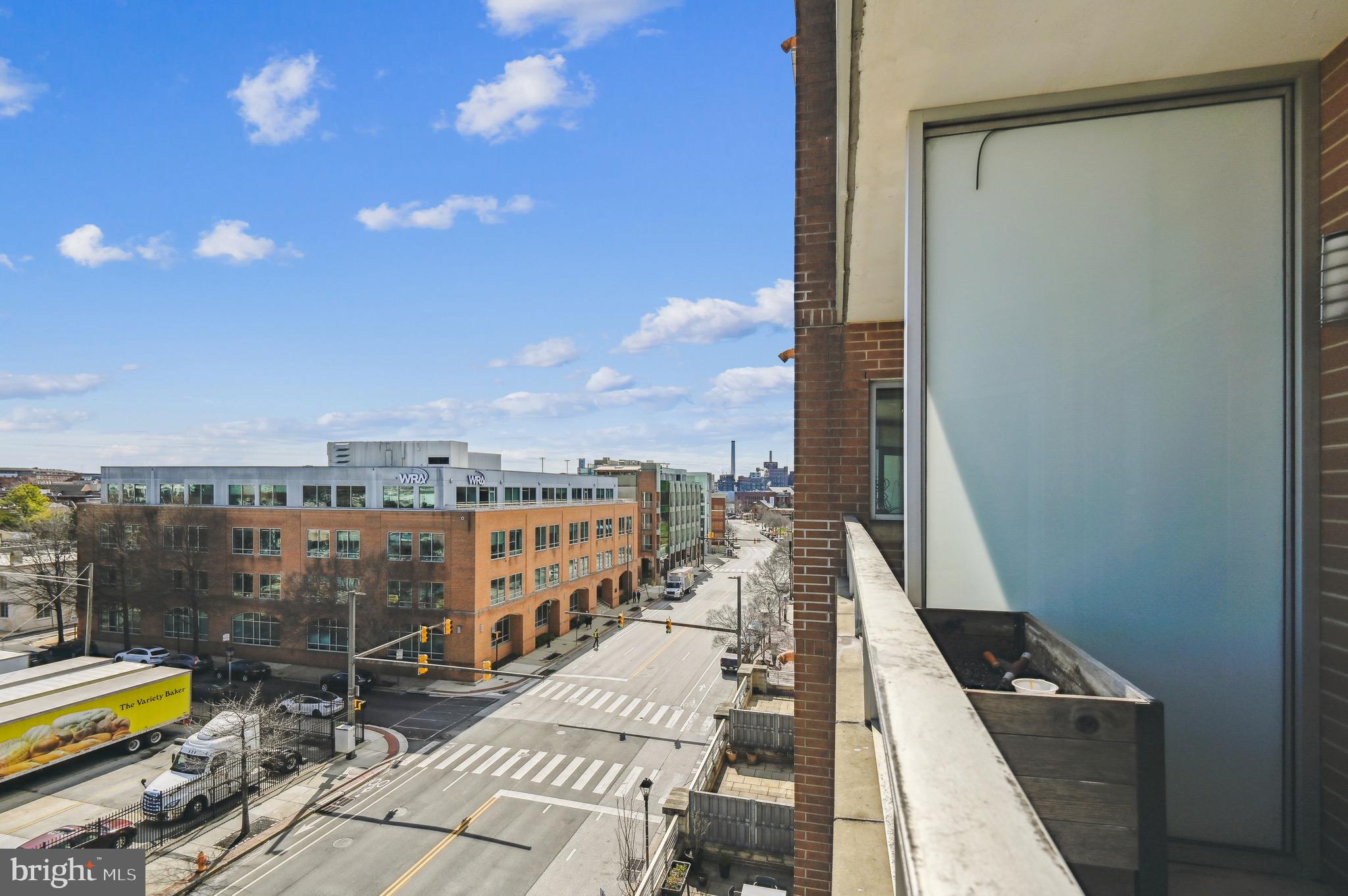 1400 Lancaster Street, Unit 605 Baltimore, MD 21231 - Photo 31 of 44 a view of a balcony with two chairs