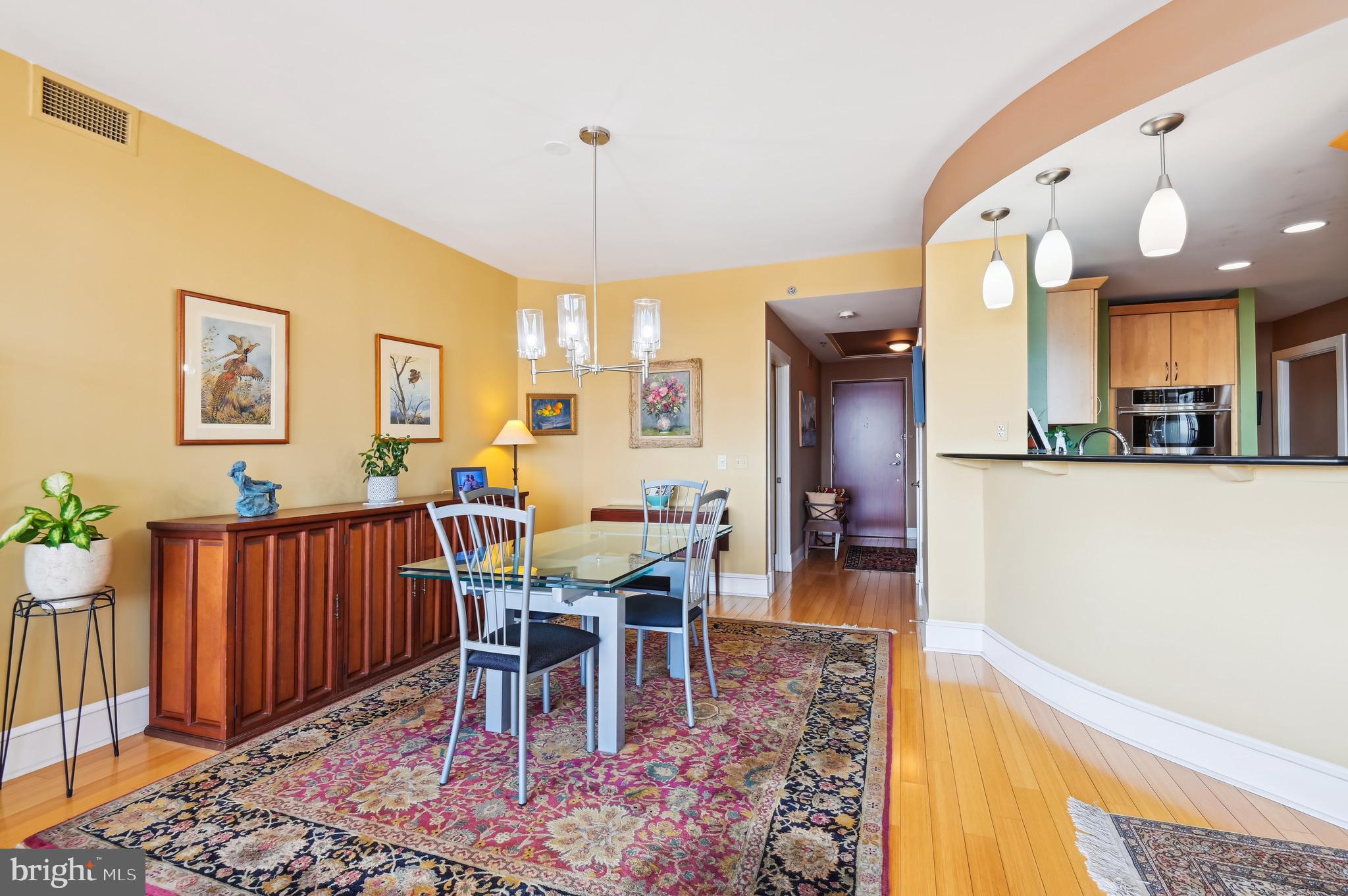 1400 Lancaster Street, Unit 605 Baltimore, MD 21231 - Photo 5 of 44 a view of a dining room with furniture