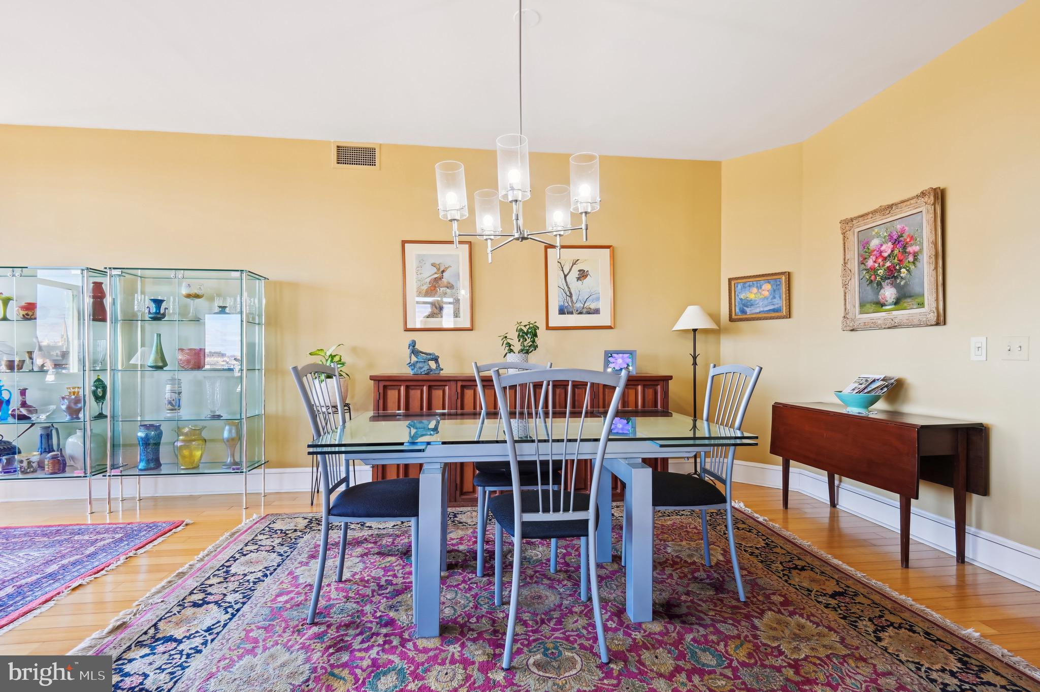 1400 Lancaster Street, Unit 605 Baltimore, MD 21231 - Photo 6 of 44 a dining room with furniture and wooden floor