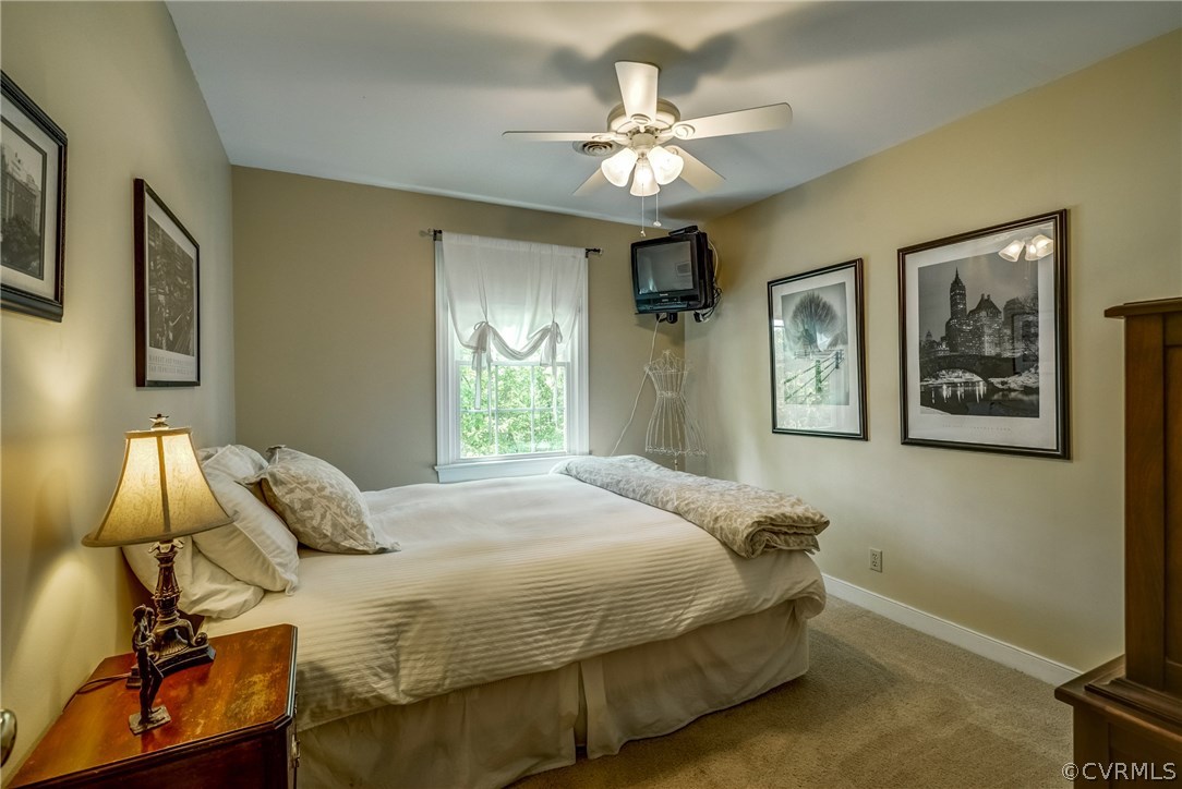 2021 Thornleigh Road Midlothian, VA 23113 - Photo 33 of 49 a bedroom with a bed and a window