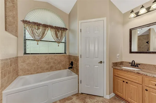 an empty room with wooden floor a ceiling fan and closet