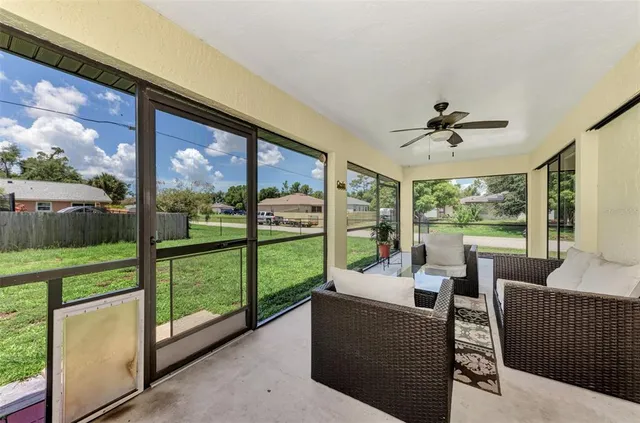 a view of a house with backyard and a garden