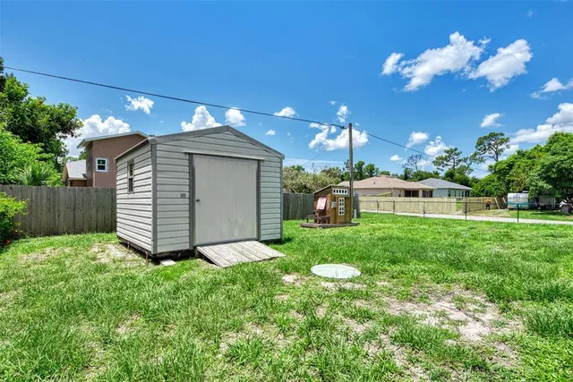 an aerial view of a house with yard