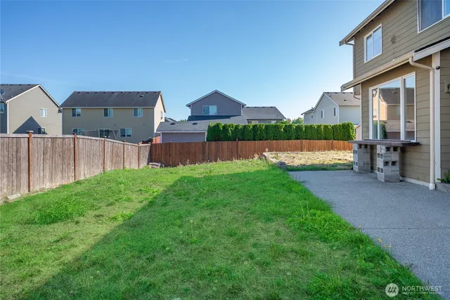a view of an house with backyard and outdoor space