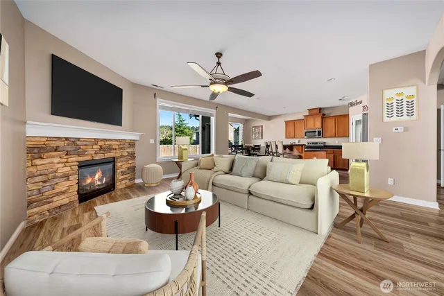 a living room with furniture fireplace and a flat screen tv