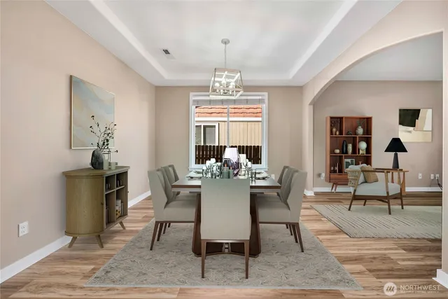 a view of a dining room with furniture window and wooden floor