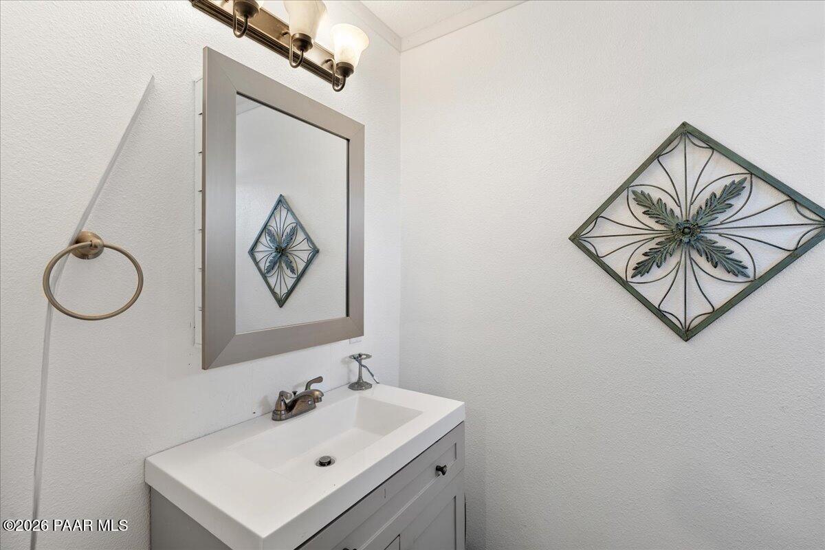 46812 8th Street Ash Fork, AZ 86320 - Photo 14 of 26 a bathroom with a sink and a mirror