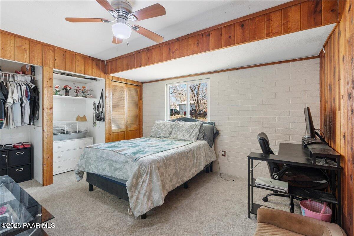 46812 8th Street Ash Fork, AZ 86320 - Photo 15 of 26 a bedroom with a bed and a chandelier