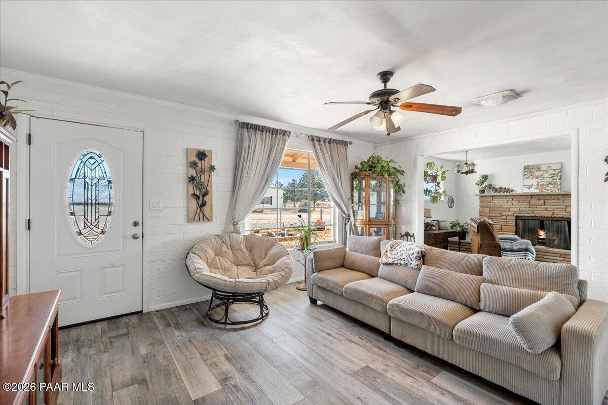 46812 8th Street Ash Fork, AZ 86320 - Photo 3 of 26 a living room with furniture a lamp and a large window