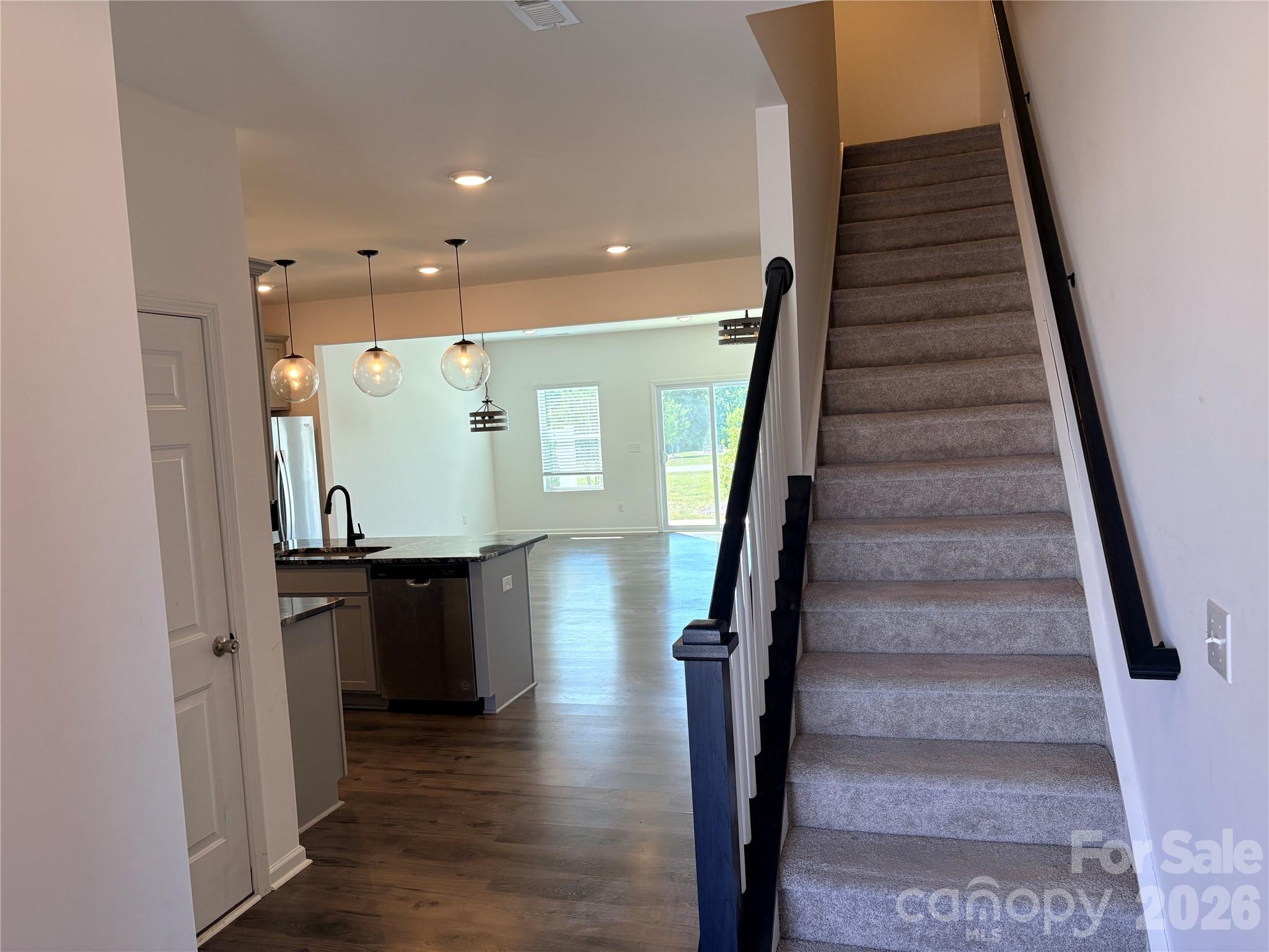 514 Station Street Clover, SC 29710 - Photo 3 of 17 a view of entryway with wooden floor and stairs