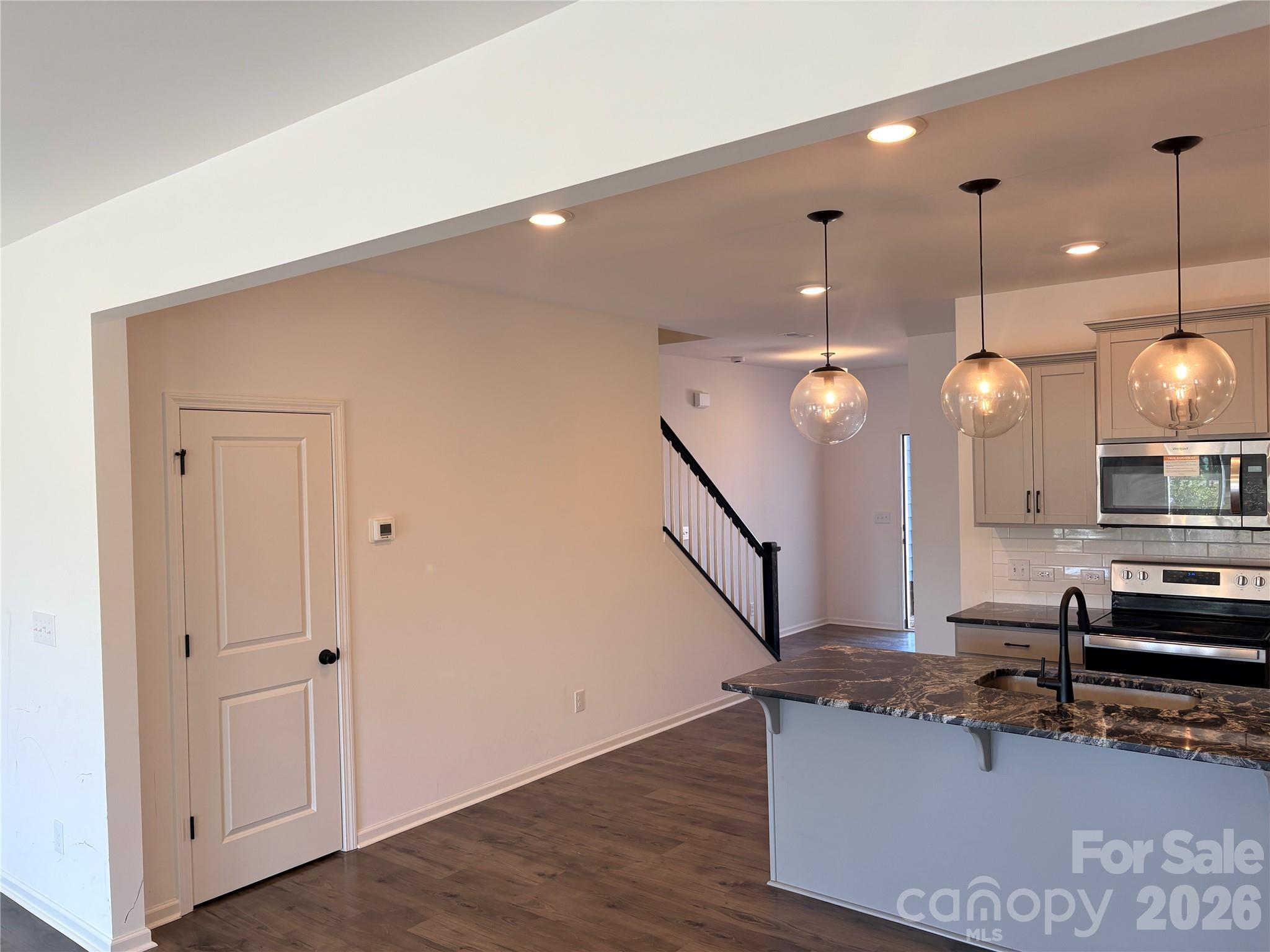 514 Station Street Clover, SC 29710 - Photo 4 of 17 a view of a kitchen with a sink and chandelier