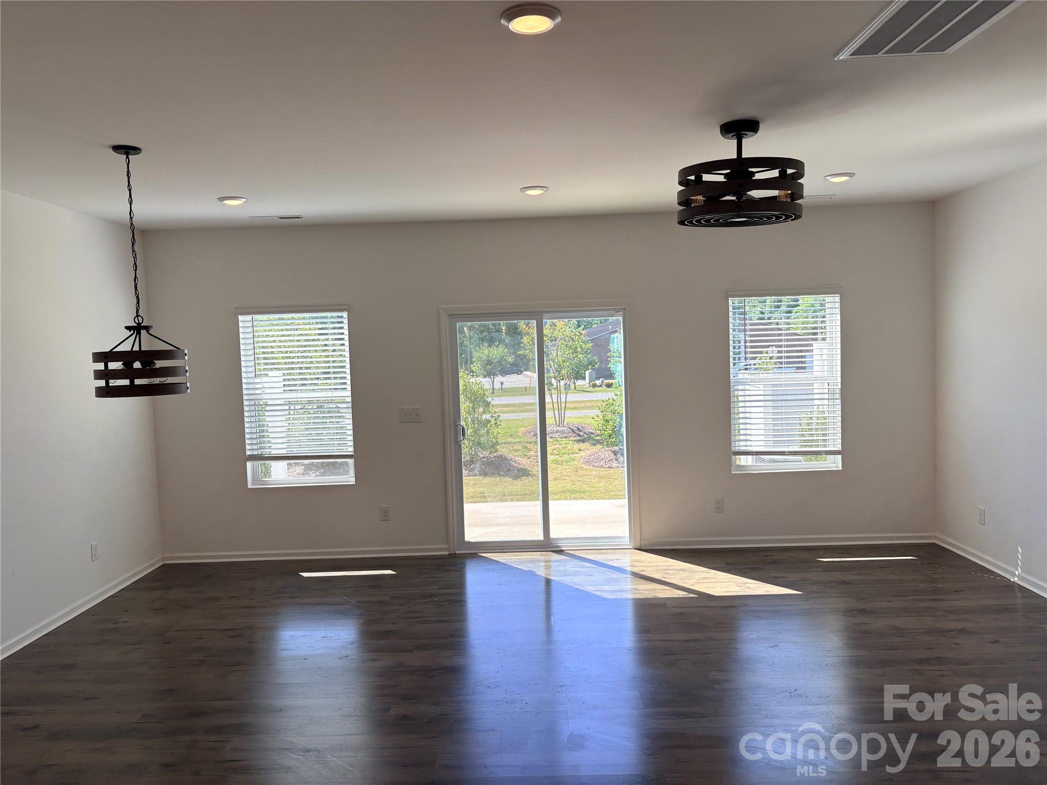 514 Station Street Clover, SC 29710 - Photo 5 of 17 a view of an empty room with wooden floor and a window