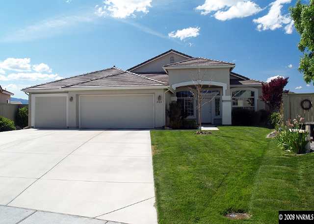 1725 Big Boulder Court Reno, NV 89521 - Photo 1 of 9 a front view of a house with a garden and yard