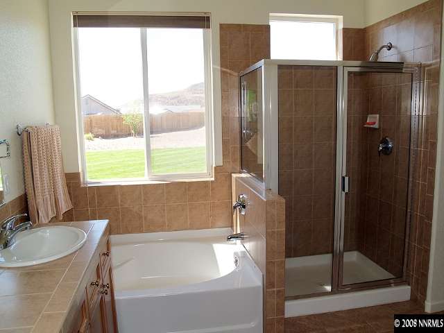 1725 Big Boulder Court Reno, NV 89521 - Photo 6 of 9 a bathroom with a tub and a sink