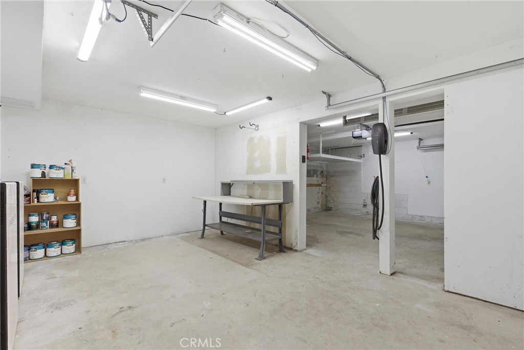 41 Hidden Valley Road Monrovia, CA 91016 - Photo 40 of 51 Workspace area in garage with Tesla charger