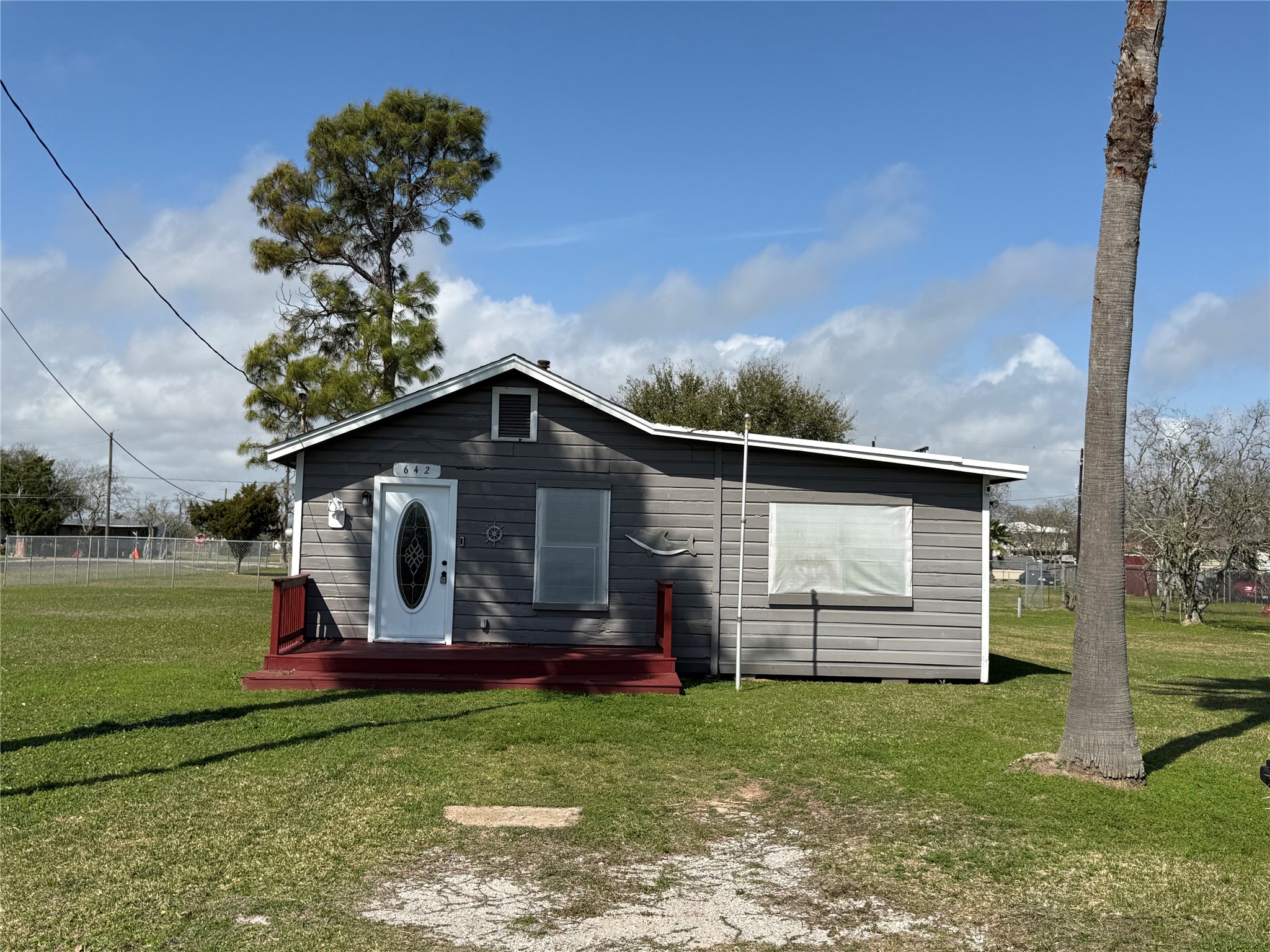 642 5th Street San Leon, TX 77539 - Photo 1 of 10 a front view of a house with garden