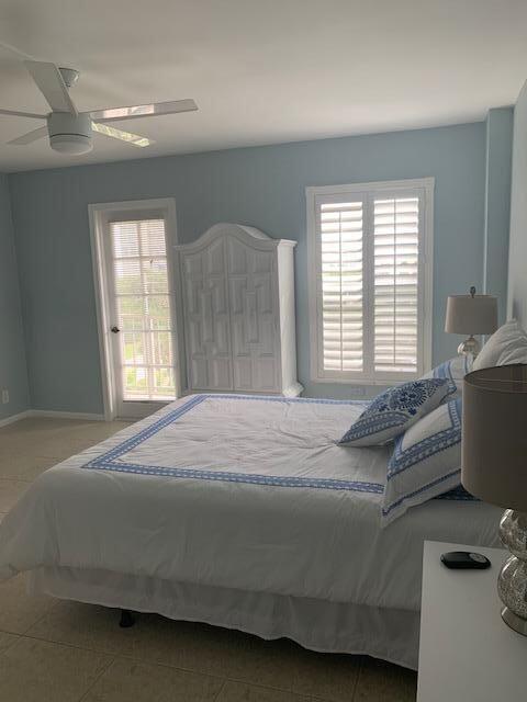 950 Ponce De Leon Road, Unit 5010 Boca Raton, FL 33432 - Photo 11 of 15 a bedroom with a bed and window