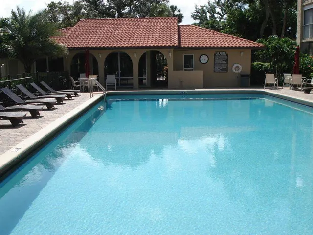 a front view of house with yard and trees