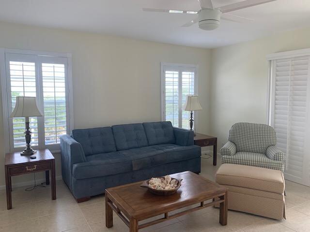 950 Ponce De Leon Road, Unit 5010 Boca Raton, FL 33432 - Photo 7 of 15 a living room with furniture and a large window
