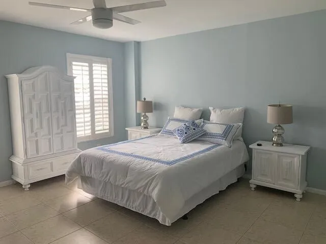 a bedroom with a bed and a cabinets