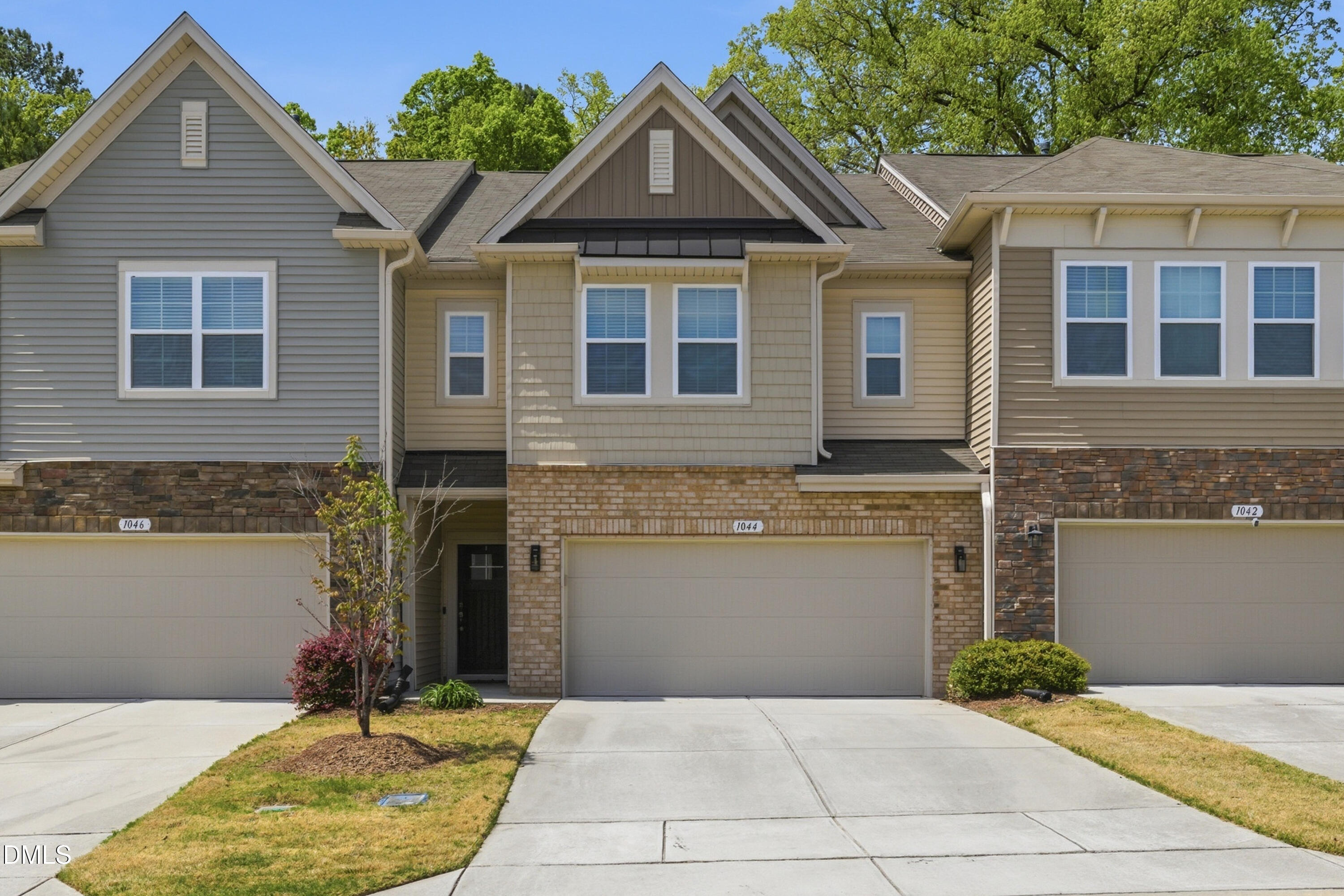 a front view of a house with yard